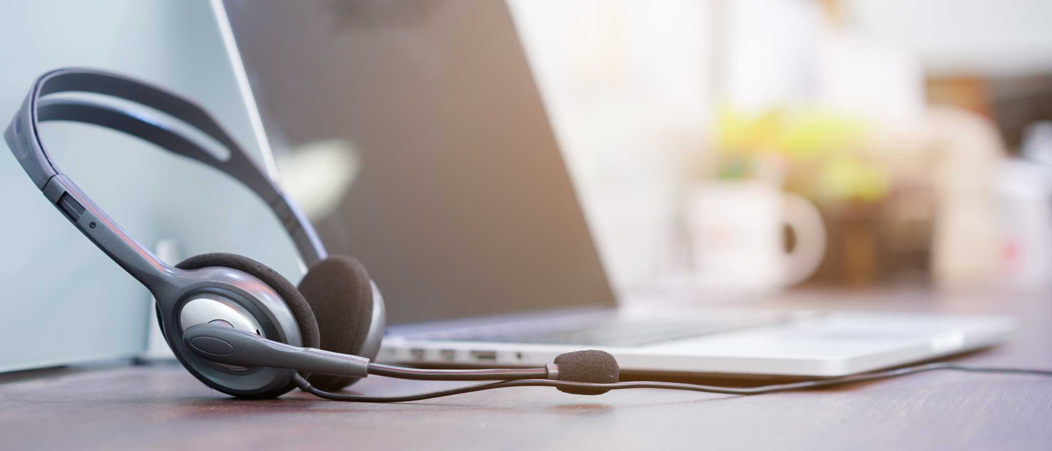 Desk with laptop and headset